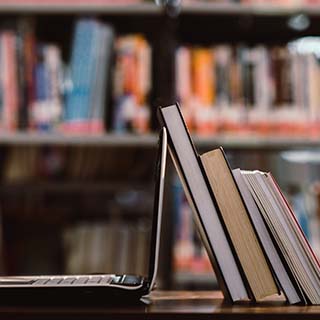 Business coworkers clasping their hands together to show unity